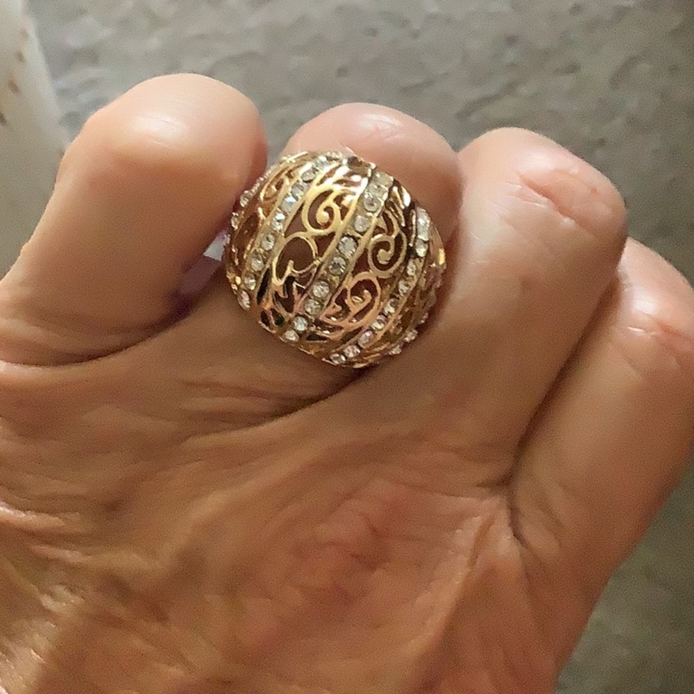 Ring gold size 7 with stones never worn nice detail to this ring unusual…